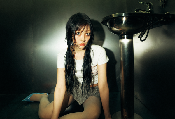 Yves sitting next to a sink and looking to the camera