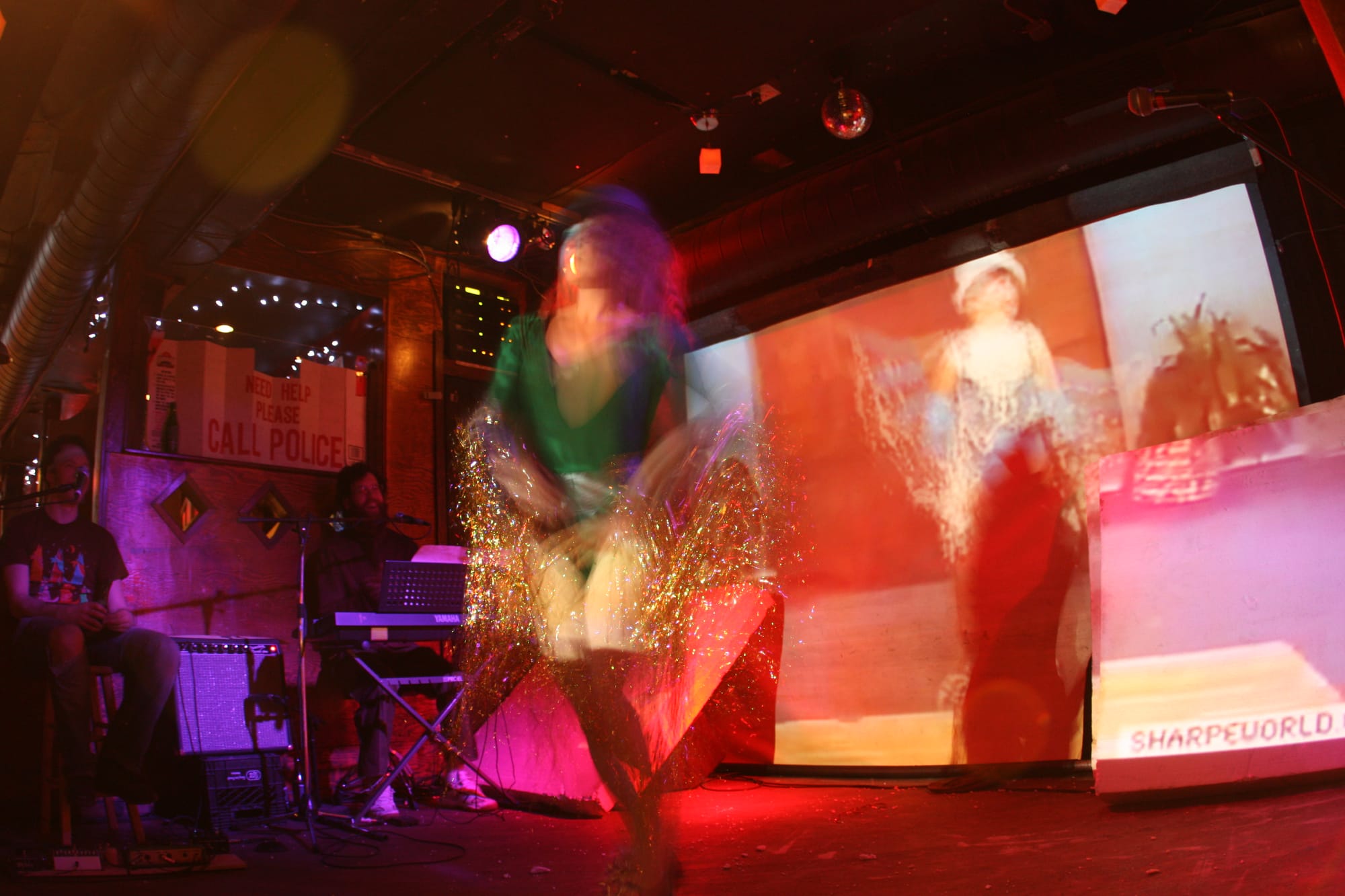 A woman tap dancing on a stage.
