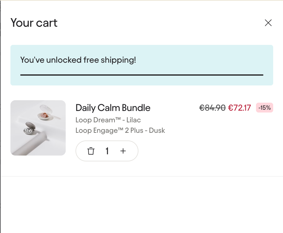 Shopping cart interface showing unlocked free shipping after reaching a minimum cart value threshold.
