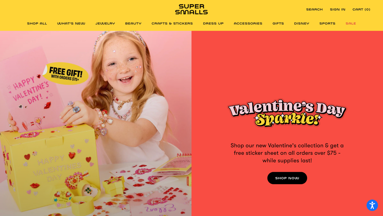 Colorful ecommerce homepage banner promoting a Valentine’s Day campaign with a free gift offer on orders over $75, featuring a child surrounded by stickers and accessories.