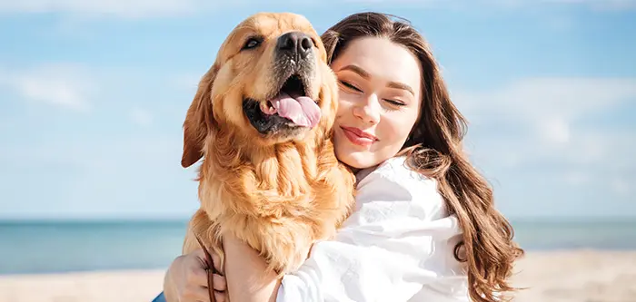 young woman with smiling dog