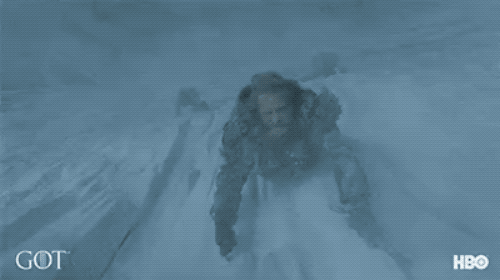 an animated GIF from Game of Thrones of one of the characters using a pickaxe in full-blown blizzard to climb up a mountain.