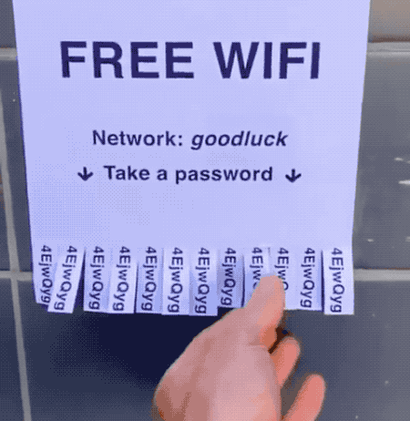 an animated GIF of a paper sign on a wall saying, "Free Wi-Fi," followed by pull-off tags. When the person pulls a tag, it produces a very very long stream of paper with a long password on it.
