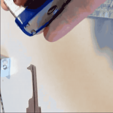 an animated GIF of Alice opening a padlock with a key that only has a single notch in it, showing that the padlock is not very secure at all.