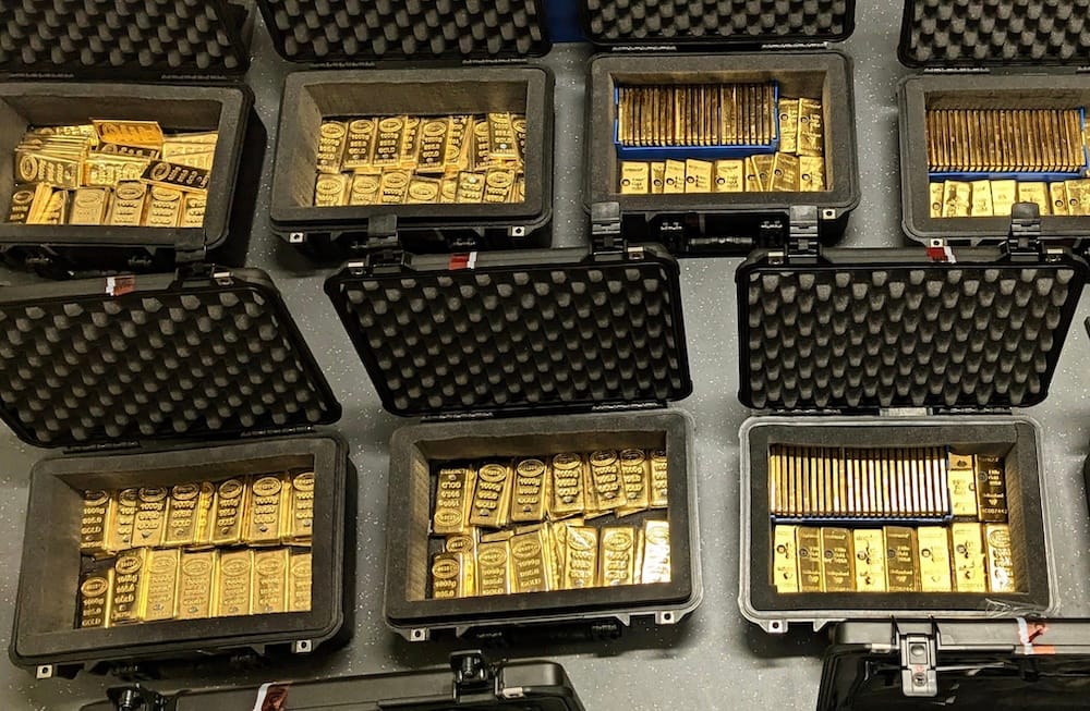 an aerial photo showing several suitcases full of gold bars.