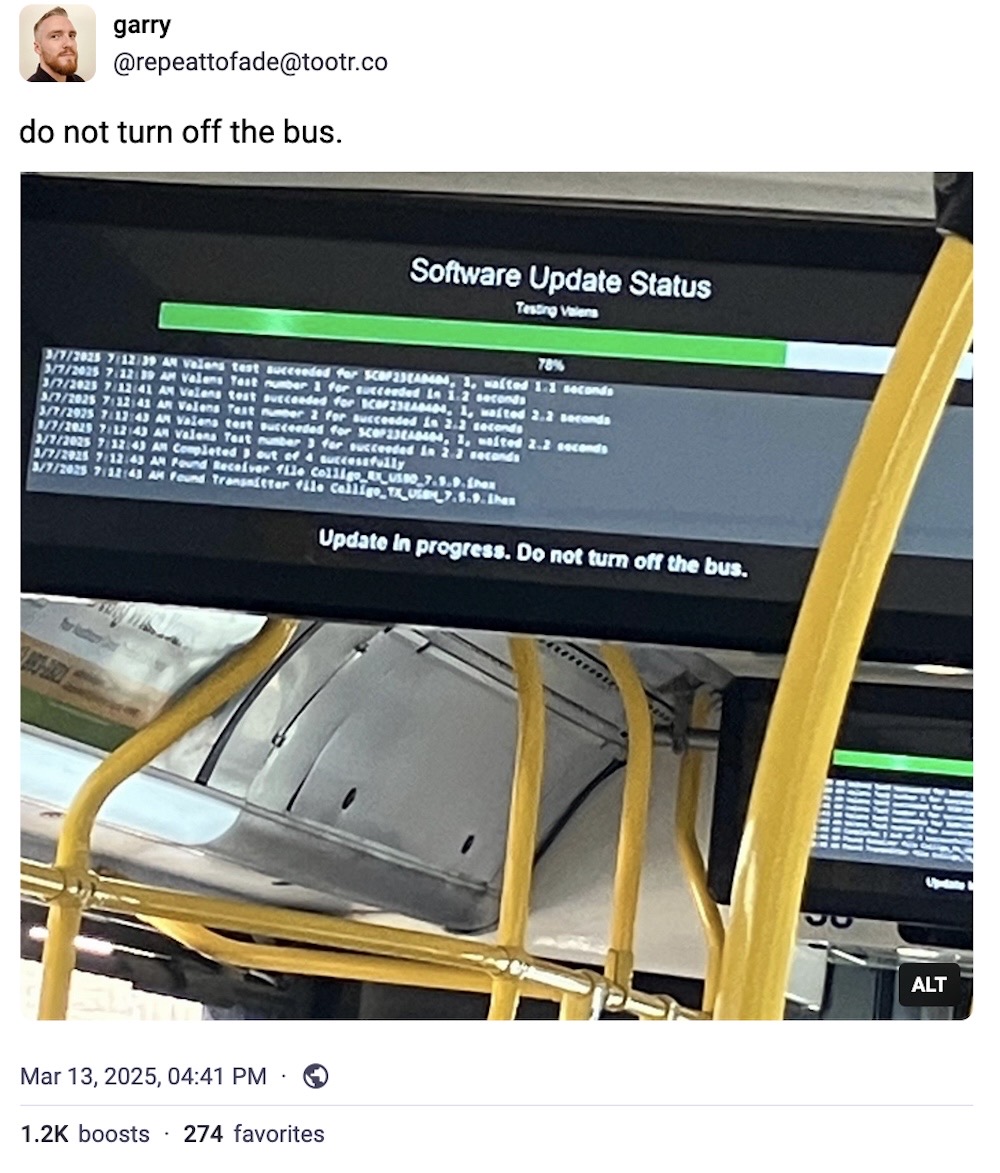 Garry post on Mastodon: "do not turn off the bus," featuring a photo of the digital display screen inside a bus, showing a software update in progress