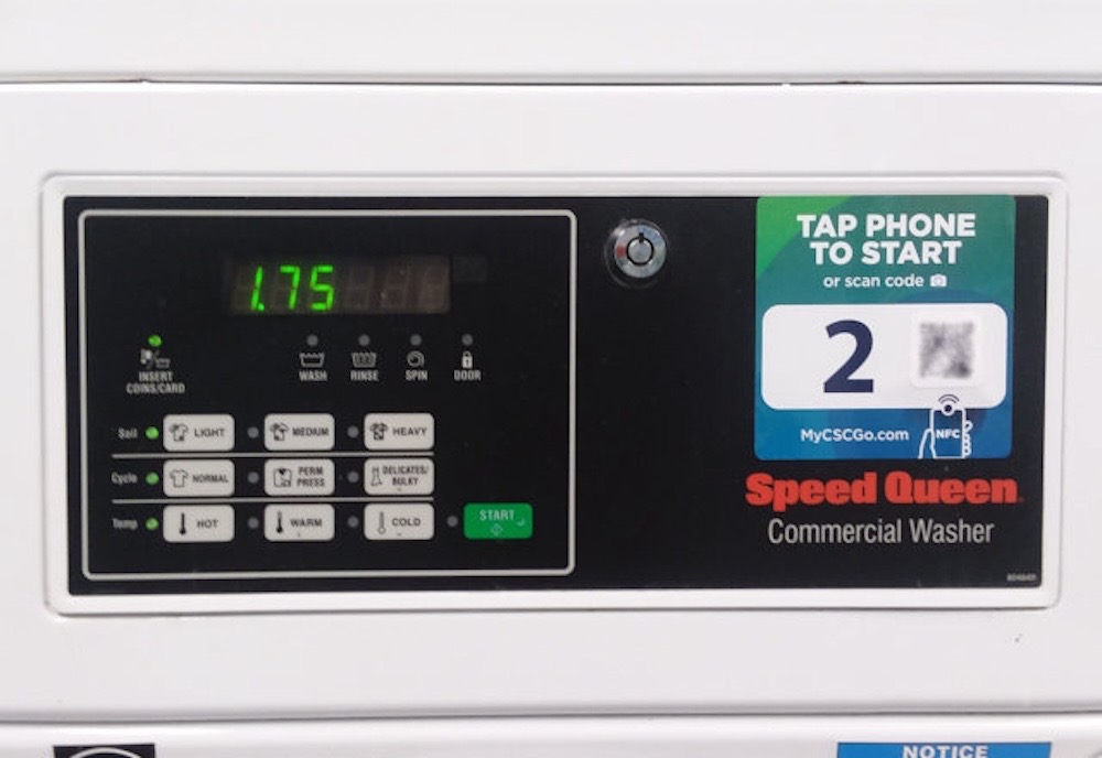 The front of a CSC Serviceworks control panel on a washing machine featuring an LED display with a balance of $1.75.