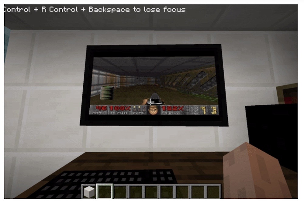 A screenshot of a user playing Minecraft while looking at a PC in the world running Windows 95 capable of playing Doom... still from within Minecraft.