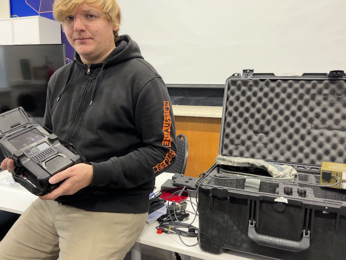 Security researcher Matthias Marx holding a decommissioned but not wiped military biometrics capture hardware device bought from eBay.