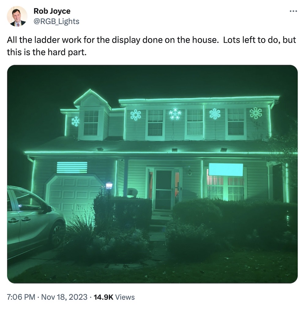 Rob Joyce tweet: "All the ladder work for the display done on the house.  Lots left to do, but this is the hard part," followed by a photo of his house lit up all green with a ton of strip lights and lit-up holiday decorations.