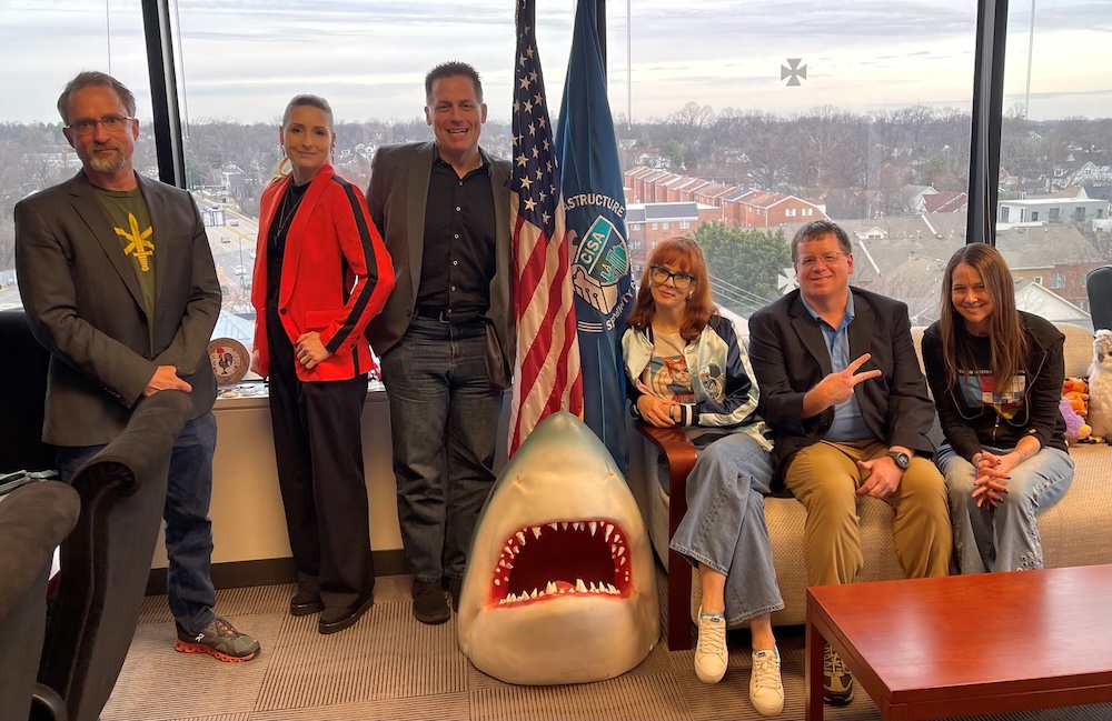 a photo of Mudge, Lesley Carhart, Ray Watson, Jake Williams, Jen Easterly, and others at CISA's headquarters in January 2024.