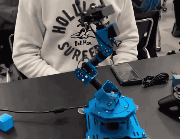 An animated GIF of a robot arm pulling the power cable out of itself, switching itself off.