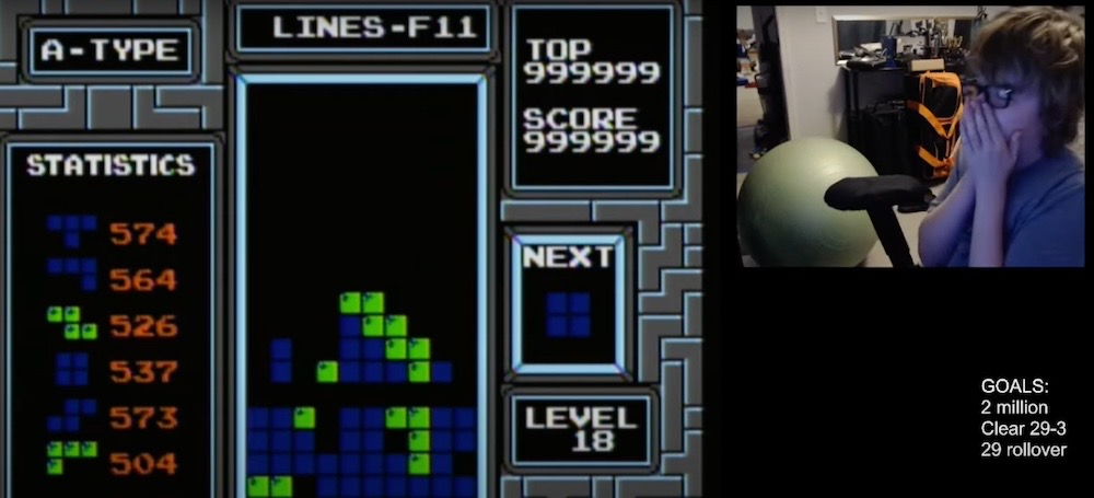 A screenshot of Tetris with Gibson in the corner, looking shocked, after reaching the Tetris kill screen.