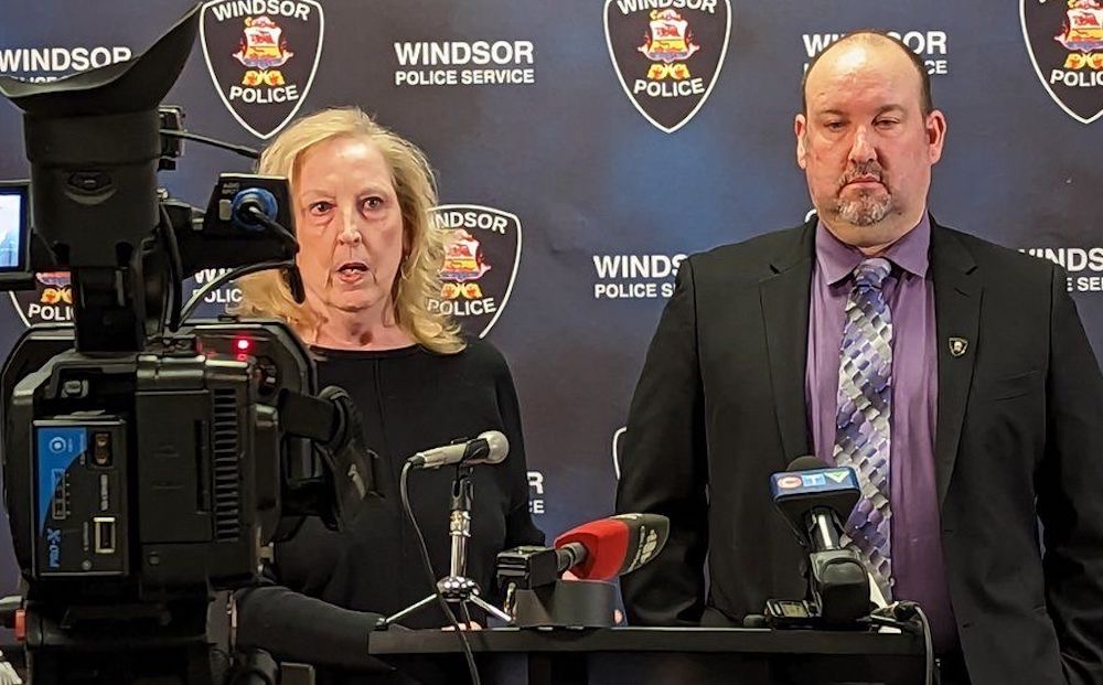 A photo from a press conference where 74-year-old grandma told media how she ensnared a scammer. Absolute legend.