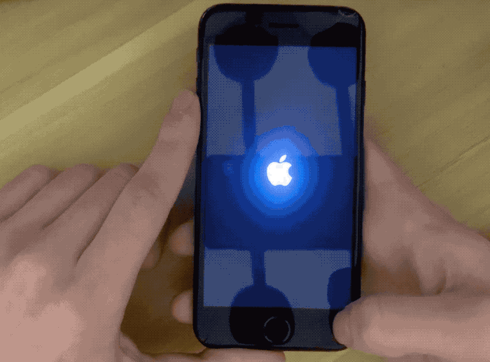 An animated GIF of a video showing an iPhone unresponsive to touch/input following the exploitation of an unpatched denial-of-service bug.