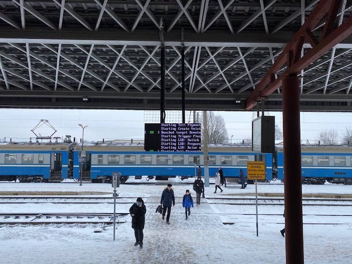 A photo of a Belarus railway station with error messages on the departures board.