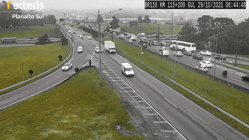 A traffic camera in Brazil, with a parrot appearing in the camera shot from above.