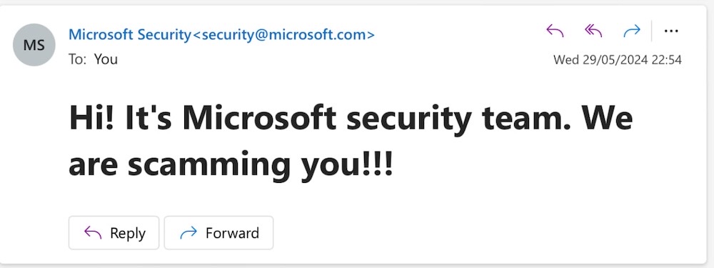 A screenshot of an email in Outlook that looks like it comes from Microsoft Security (security@microsoft.com) but reads, "Hi! It's Microsoft security team. We are scamming you!!" as a proof-of-concept to demonstrate an email spoofing bug.