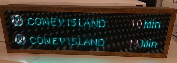 One of the NYCTrainSign digital boxes showing the recent subway train arrivals for the N line on the New York City Subway.