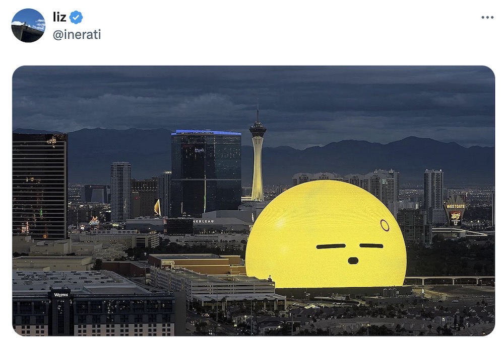 Liz tweet, featuring a photo of the Las Vegas Sphere with a giant –_– * yellow blob face emoji, indicating a tired, sleepy face