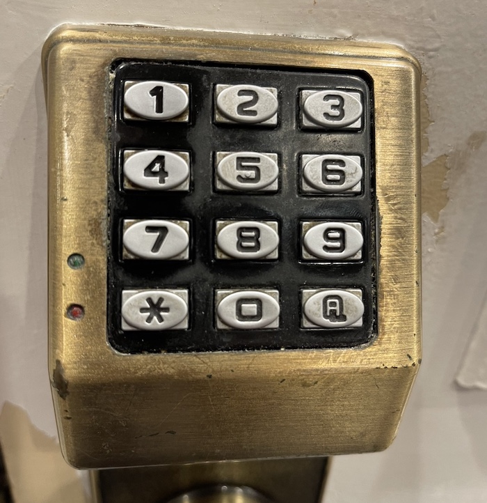 A photo of a digital PIN code door lock. Follow the link for the tweets.