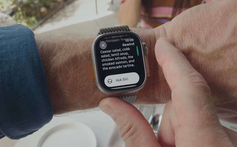 a screenshot from this week's Apple event, which shows a person looking at their Apple Watch on their wrist, which is in the "Rewind" app, and says: "Caesar salad, cobb salad, lentil soup..."