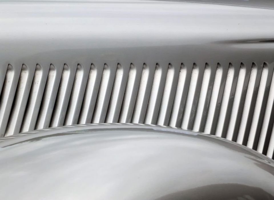 Hood side vents of an early automobile