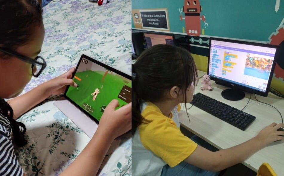 Meninas e adolescentes usando computadores e tablets em uma sala de aula de tecnologia