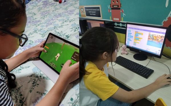 Meninas e adolescentes usando computadores e tablets em uma sala de aula de tecnologia