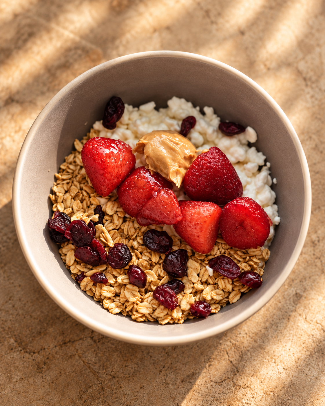 Oats with strawberries, cottage cheese, dried cranberries and peanut butter