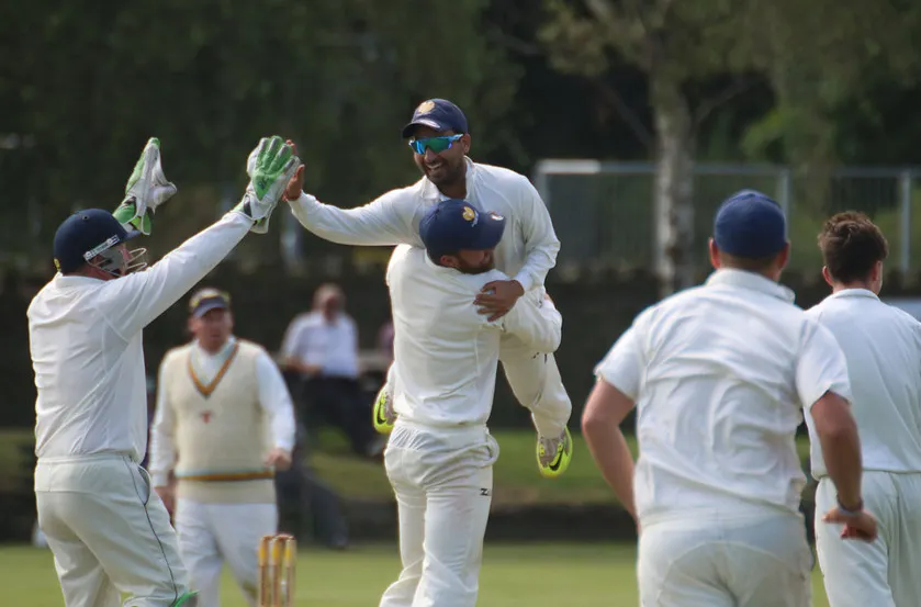 Wicket celebrations for delph and dobcross