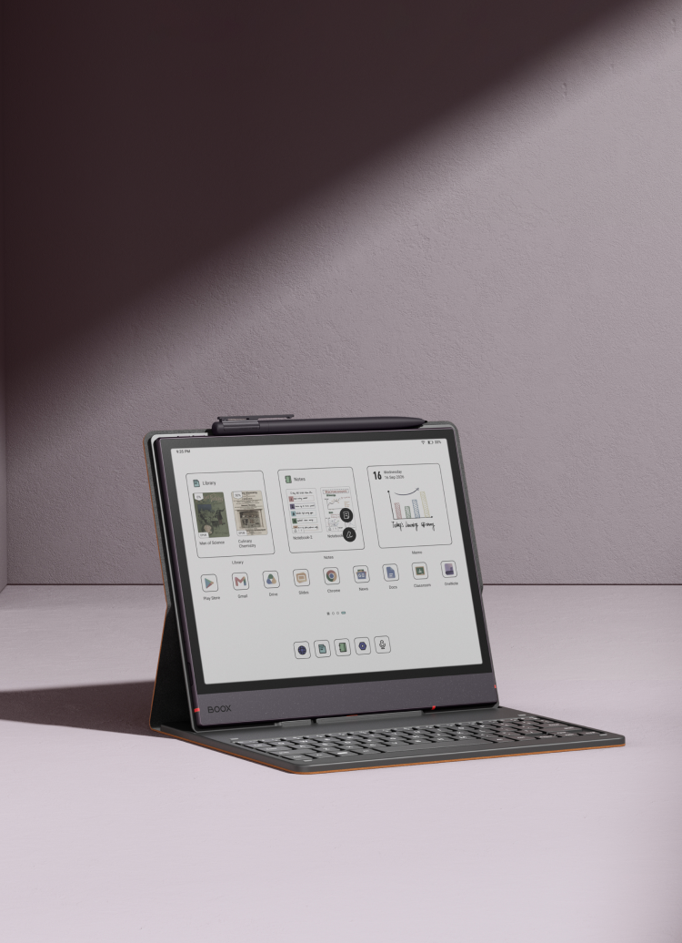 A Boox Note Air6 C e-paper notebook standing on its keyboard cover, its screen showing page thumbnails.
