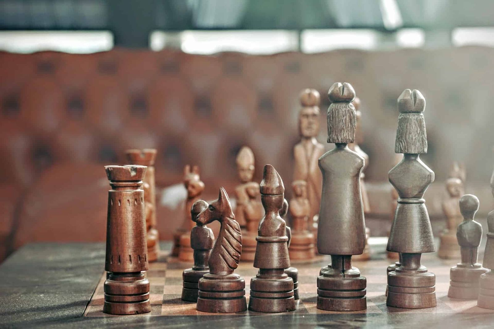 Image of a chess board with pieces arranged to start a game.
