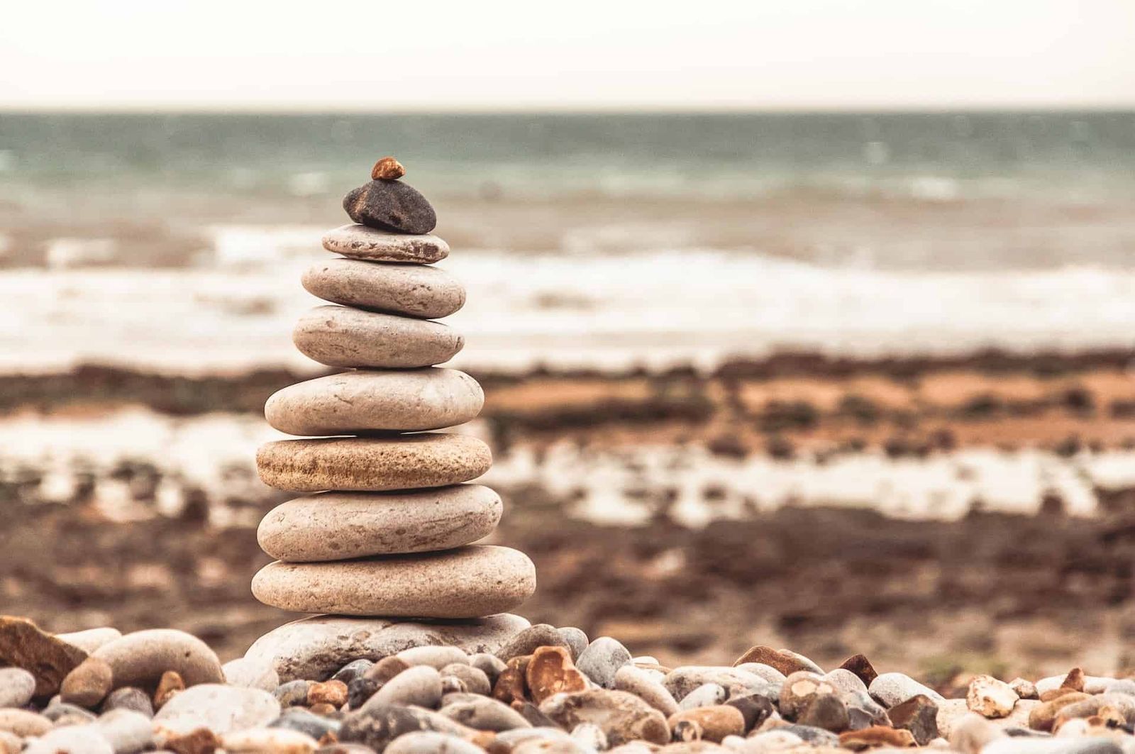 Image of a pile of rocks on a beach. Emblematic of a hierarchy.