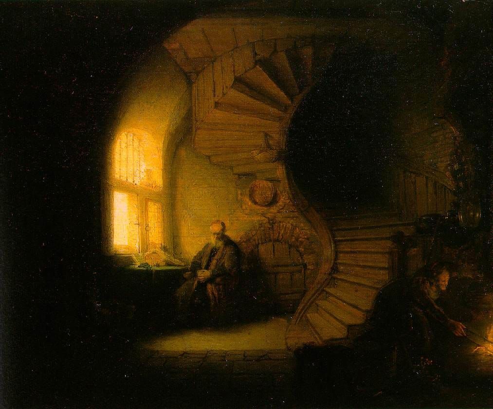 A philosopher sits by a bright window beneath a spiralling staircase, bathed in warm light, while a figure tends a small fire in the shadows of the room.