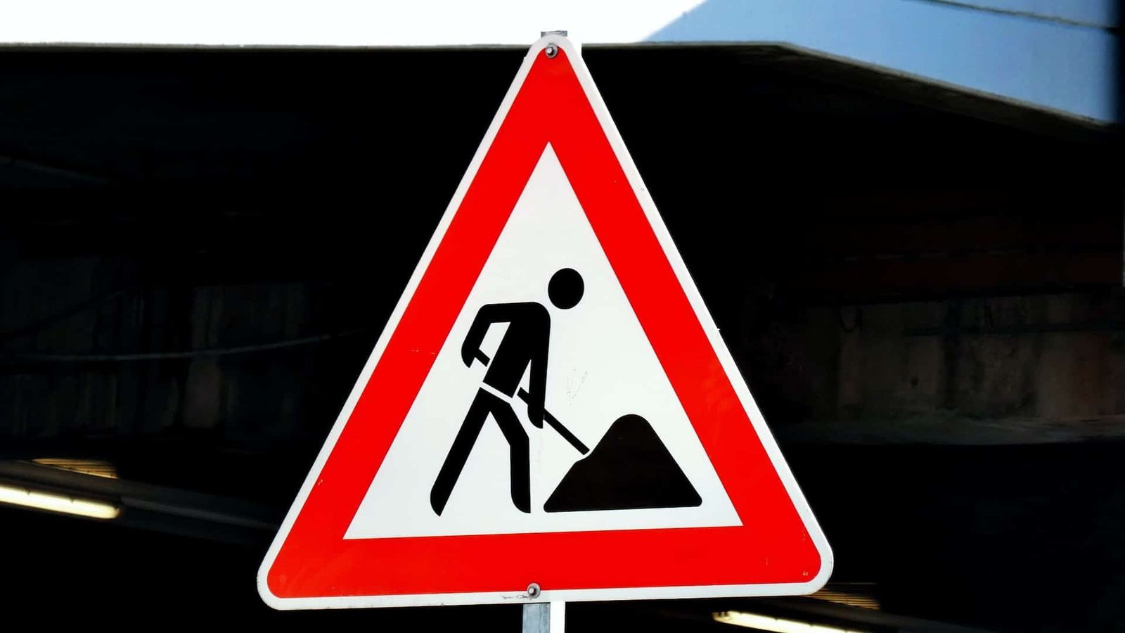 Road sign: construction ahead.