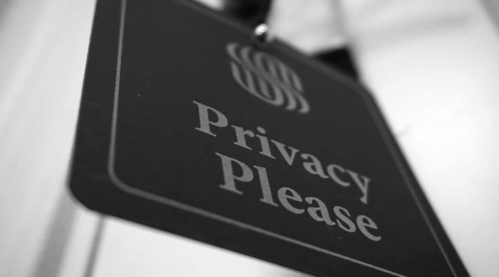Image of a sign saying 'privacy please'