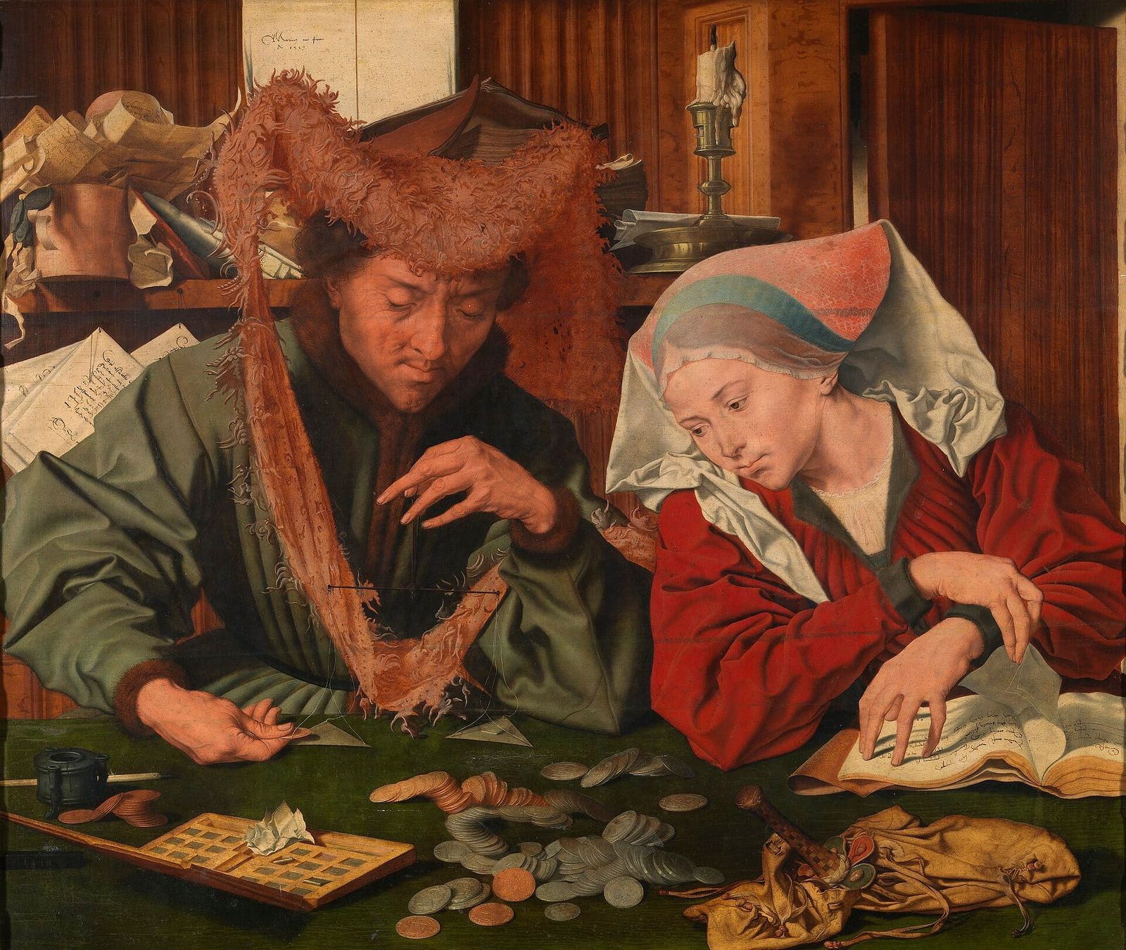 A man in a fur hat weighs coins on a small balance scale at a table. Beside him a woman in a white headdress turns the pages of an illustrated book, her eyes on the scales.