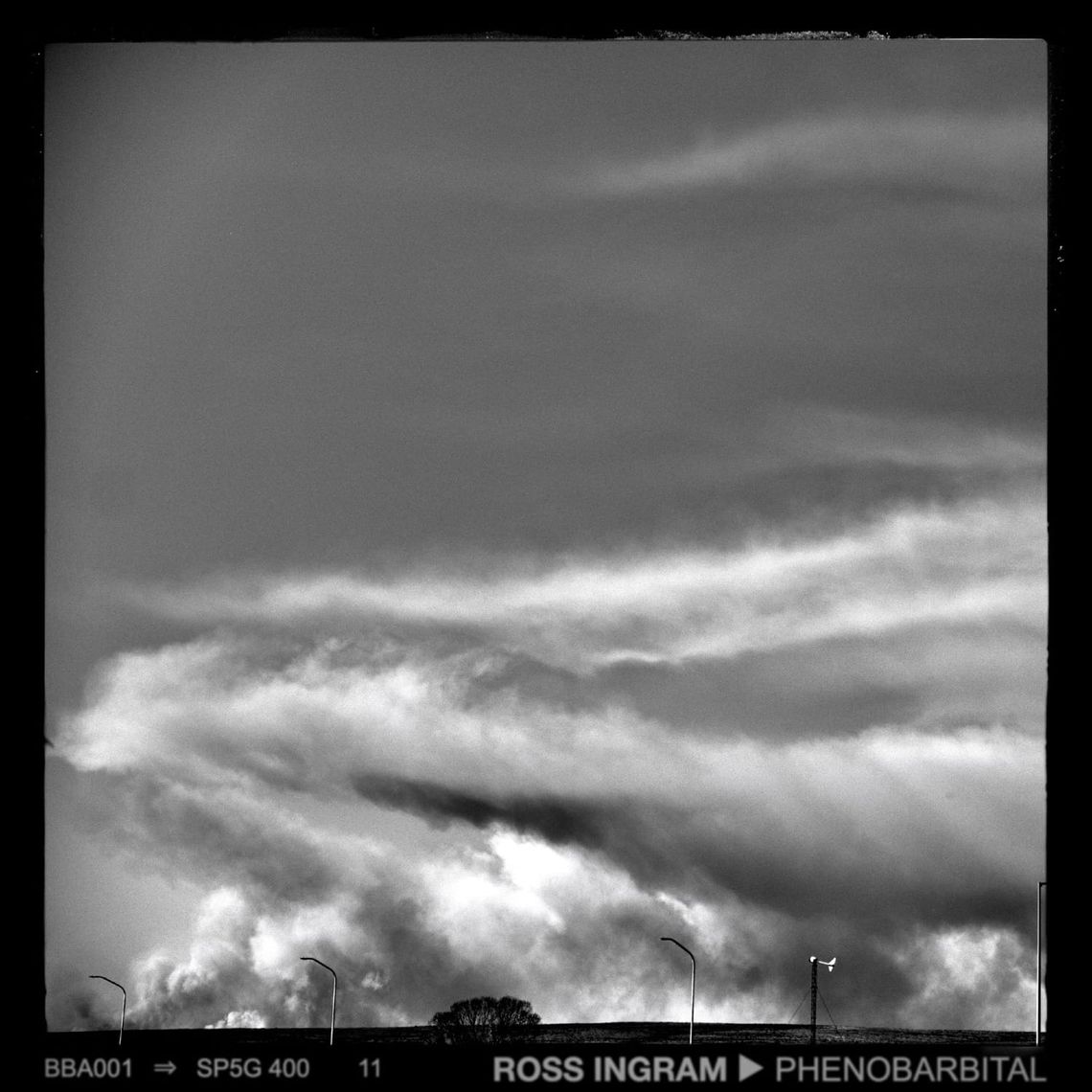 Dark smoke floats low across the northern New Mexico desert.  