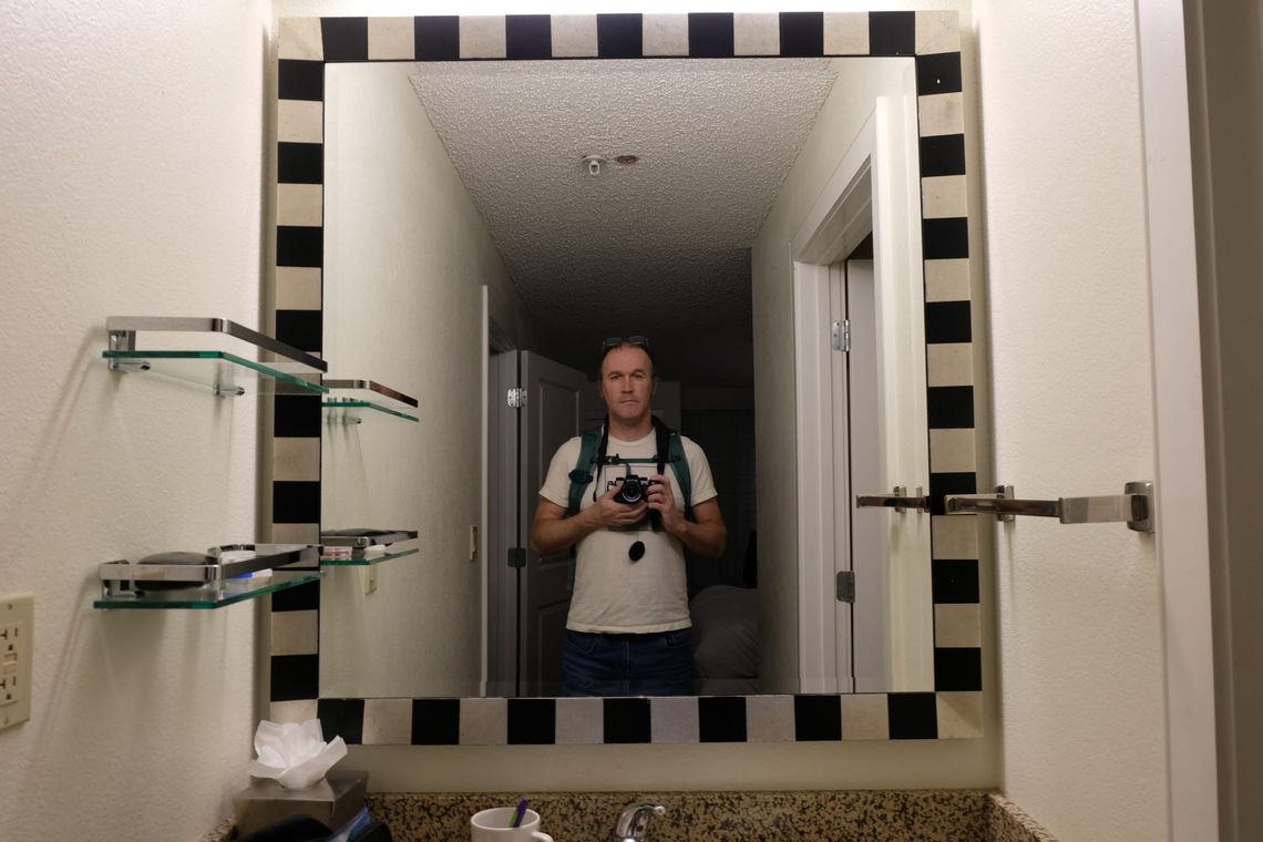 Self portrait taken in the bathroom mirror at the Residence Inn in Oklahoma City at some point in late 2025 or early 2026.