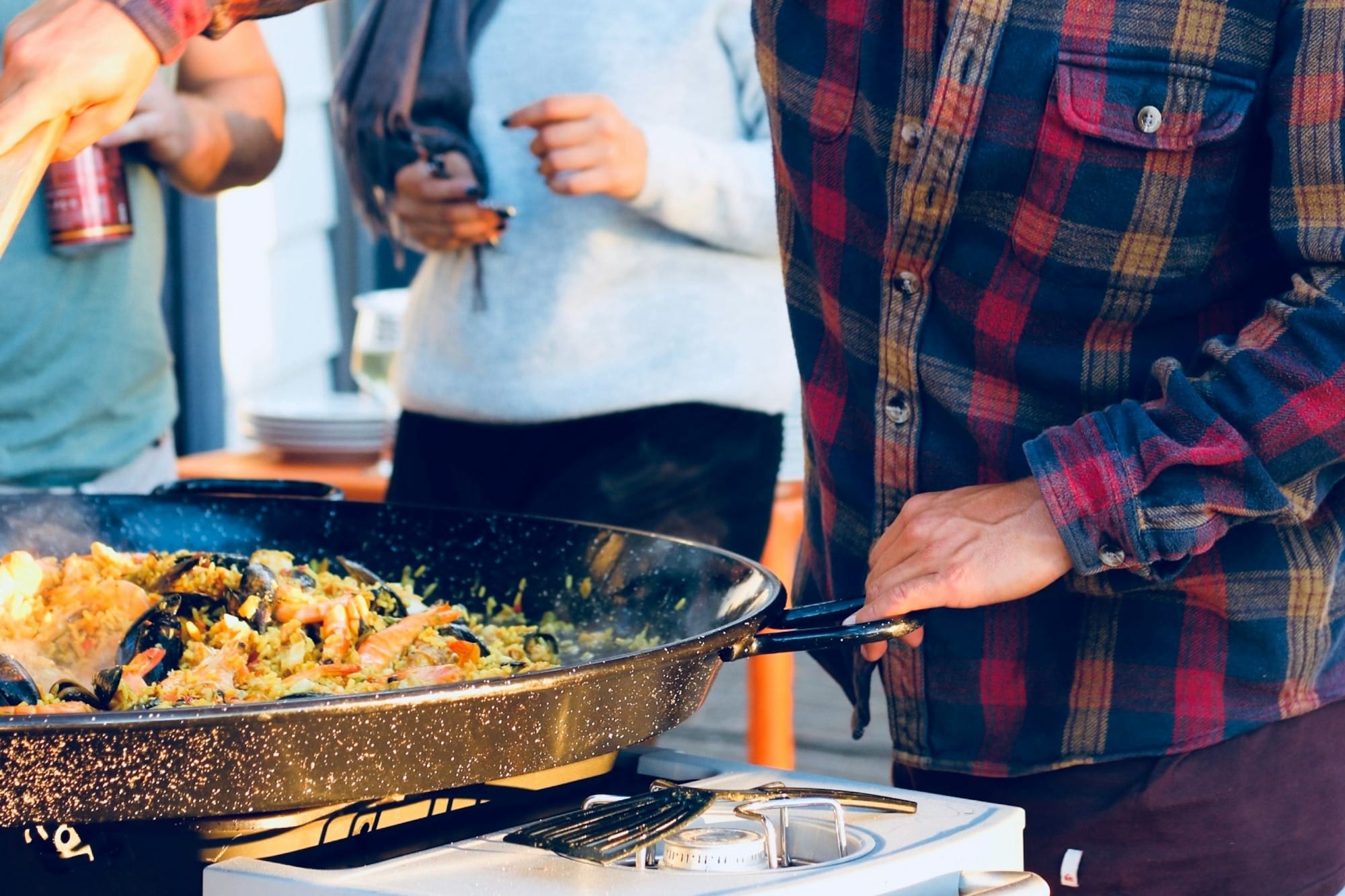 man preparing seafood for friends