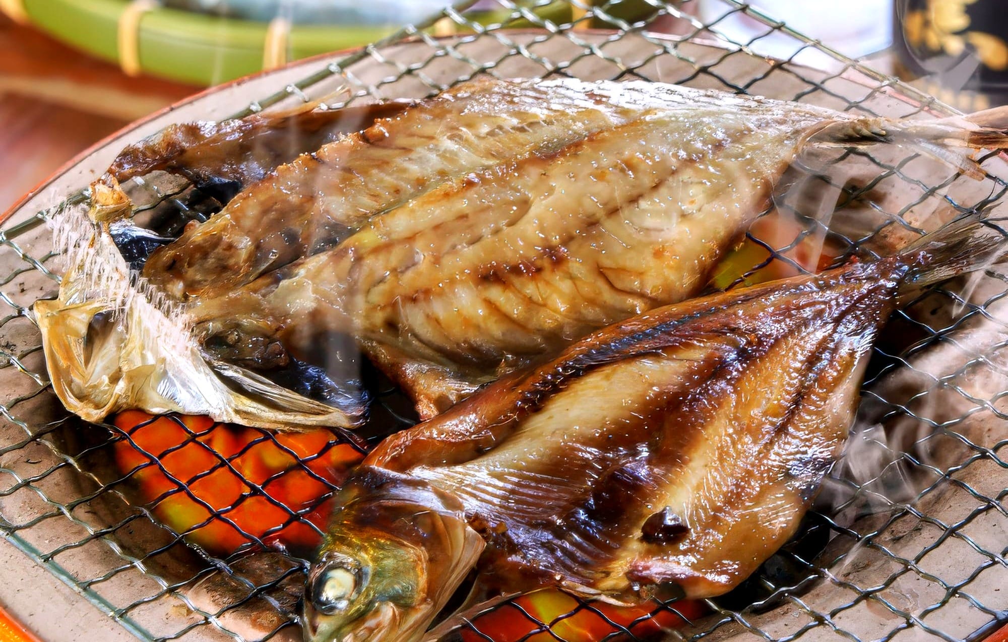 Butterflied fish being grilled