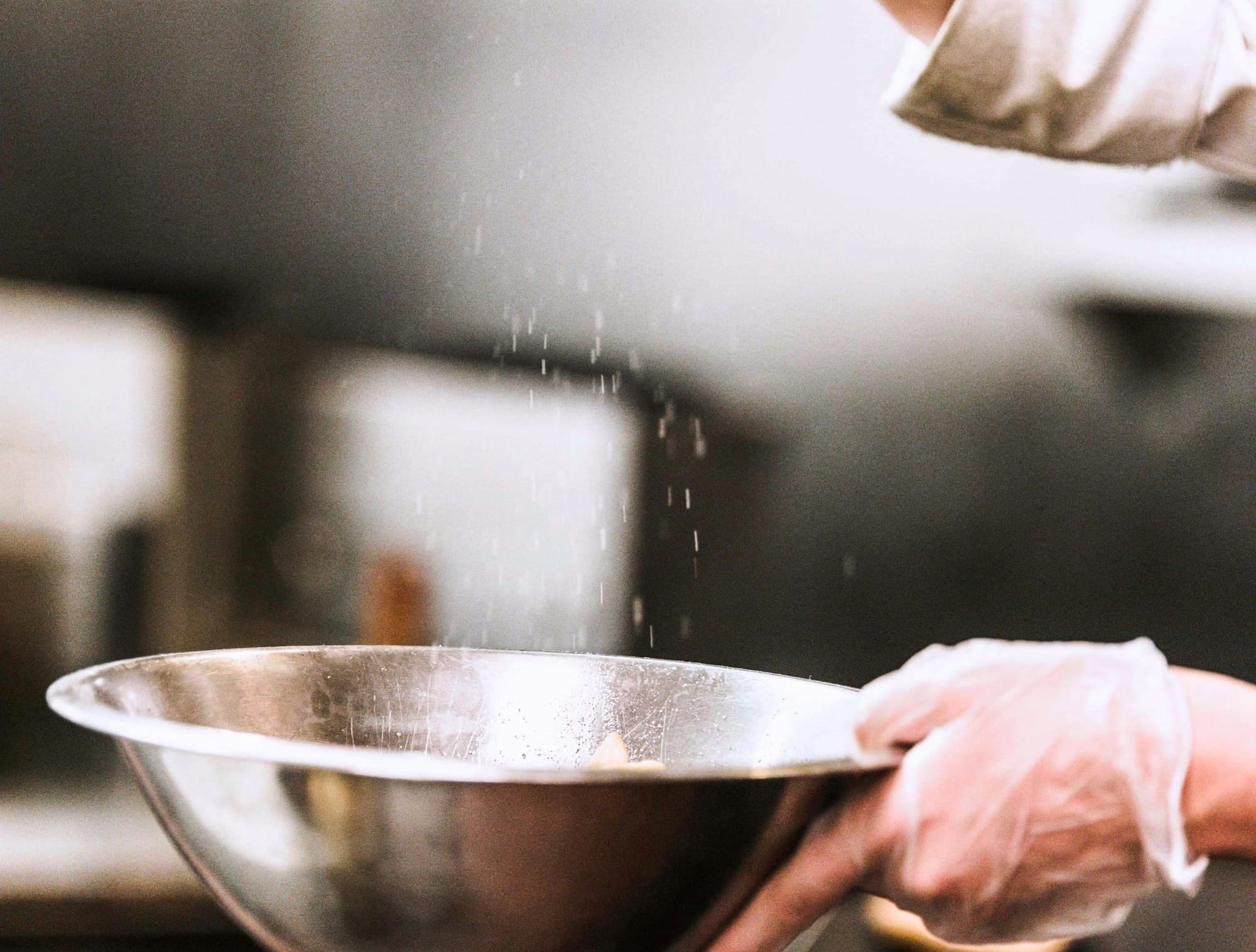 Battering food in a metal bowl