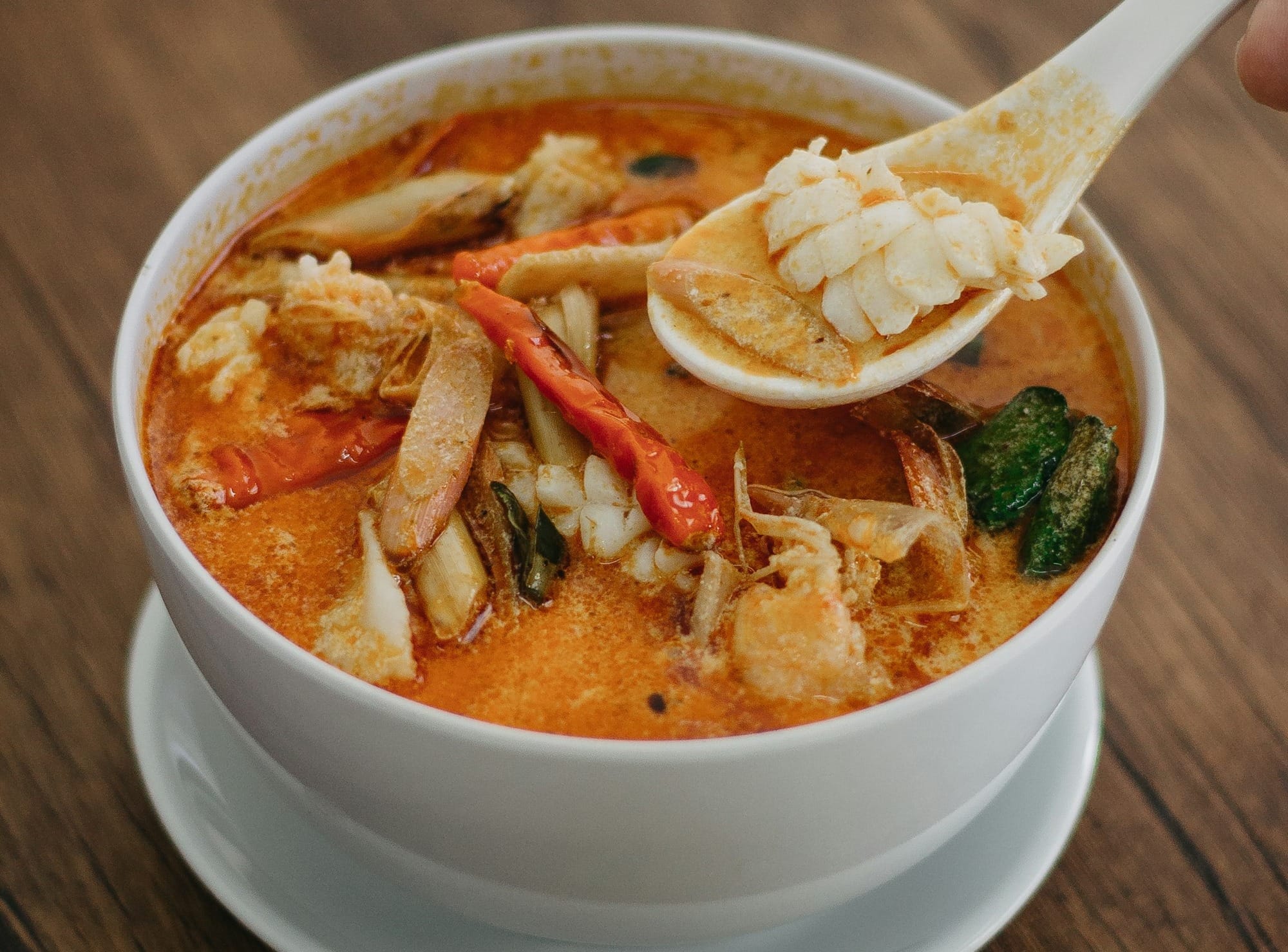 seafood soup in white ceramic bowl