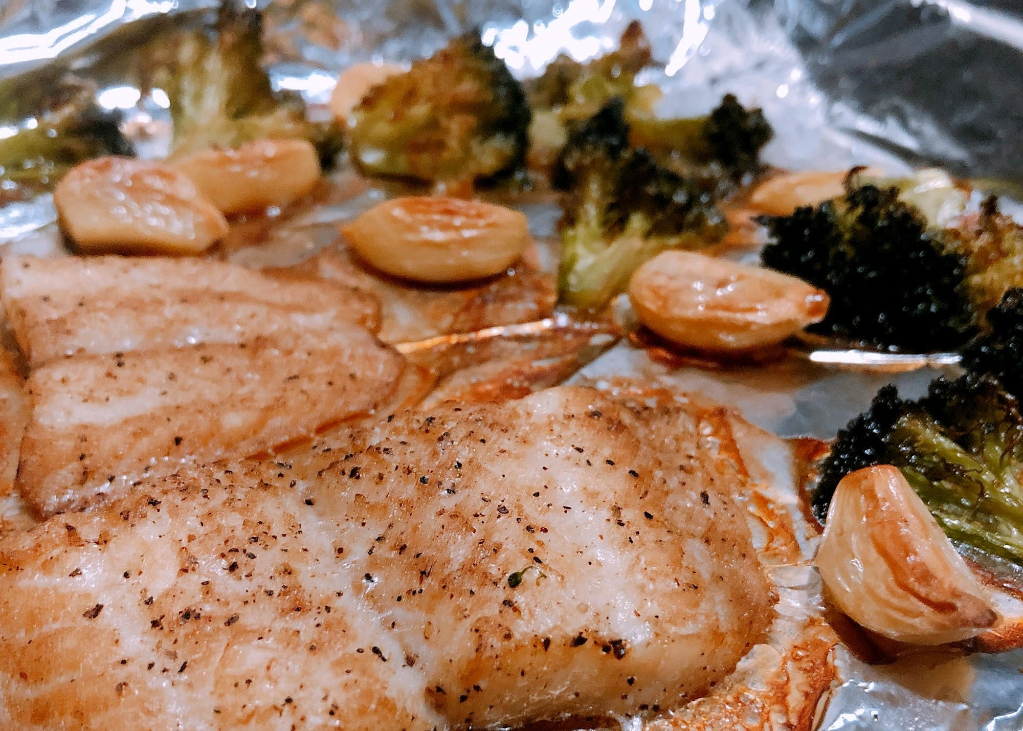 Roasted fish fillets cooked with vegetables