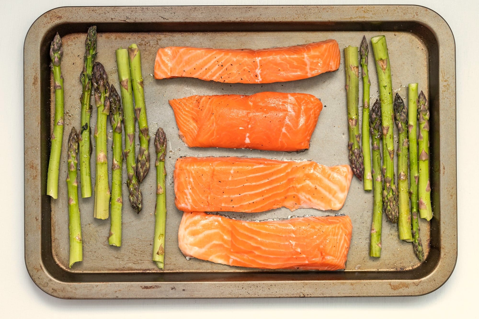 Salmon and asparagus prepped for baking