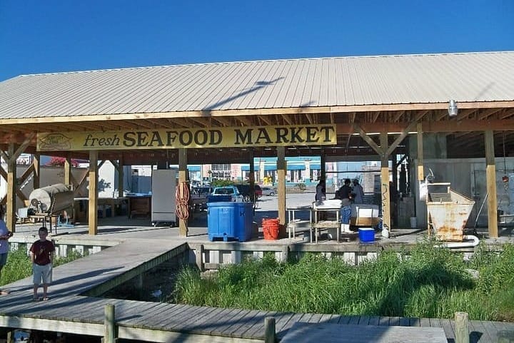 Seafood market with a dock for receiving fresh caught seafood from fishing boats