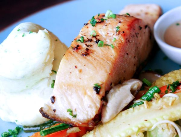 Roasted salmon with sides on a plate