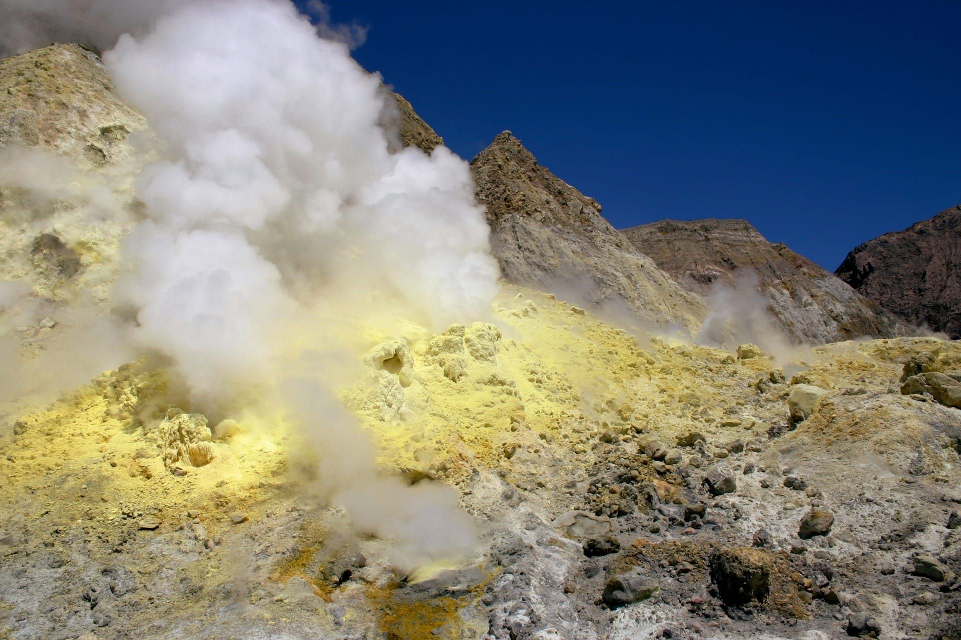Sulfurous gas billows from a volcanic vent.