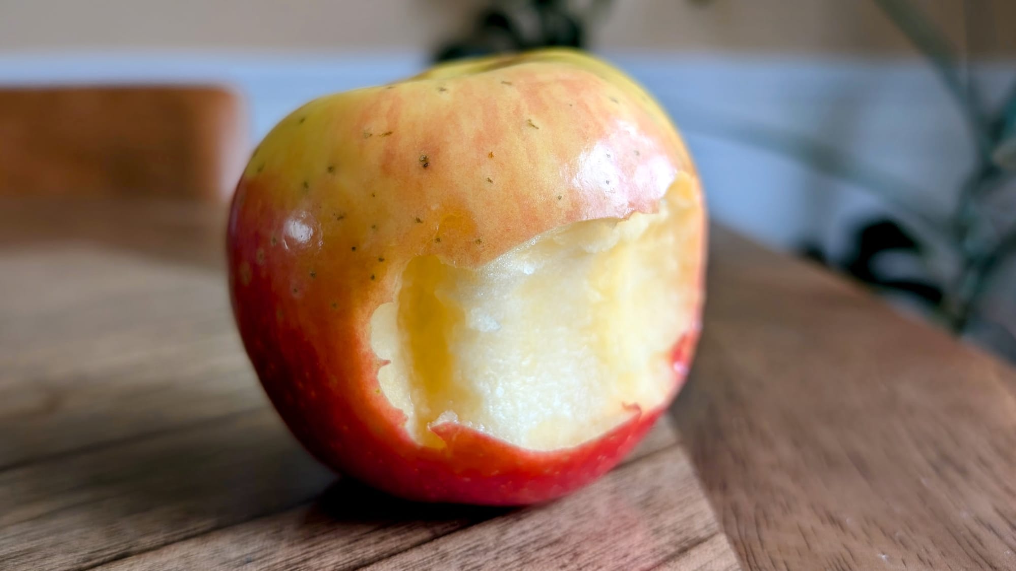 Bite taken out of the SugarBee Apple.